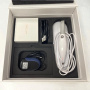 Open box of a 3DISC Heron IOS intraoral scanner showing the handpiece with cable, power adapter, connection cable and accessory box arranged in black foam packaging.
