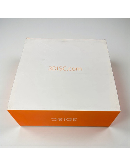 Closed 3DISC Heron intraoral scanner box with white top and orange sides showing the 3DISC.com logo.